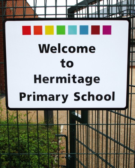 school sign on a fence at Hermitage Primary School